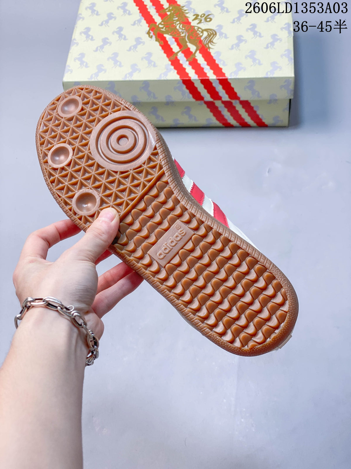 Gum-colored outsole of the white and red Gazelle Indoor sneaker