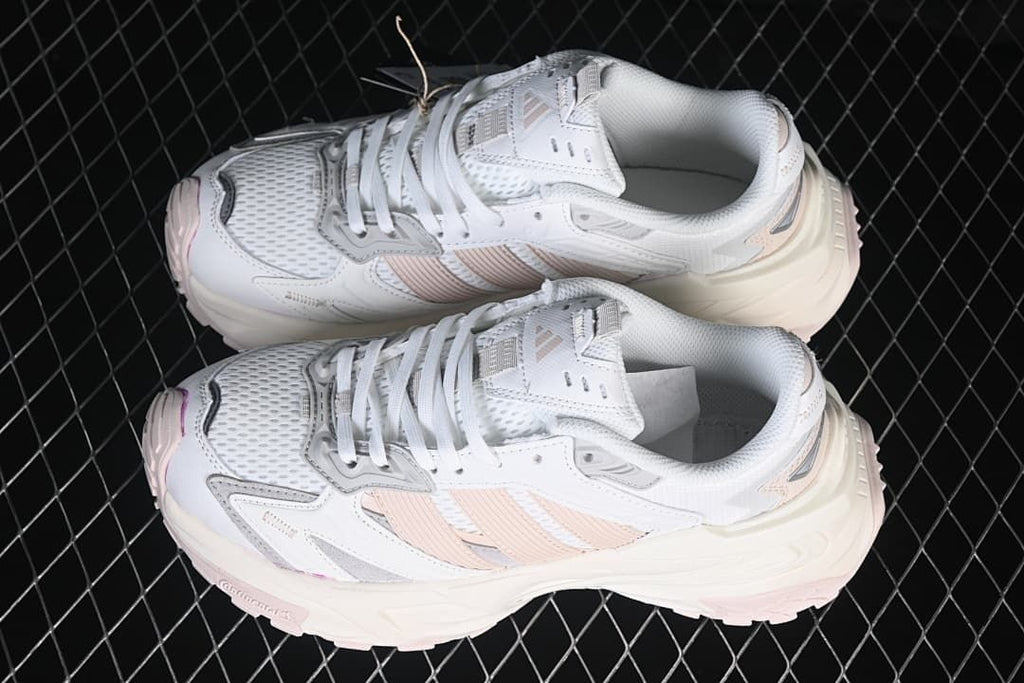 Pair of white XLG Storm Edge sneakers with pink accents