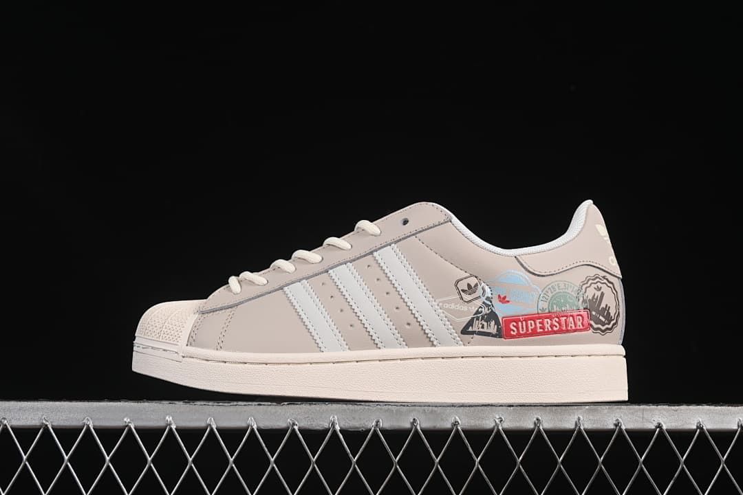 Side profile of the beige and white adidas Superstar II JR1330 with colorful side graphics.