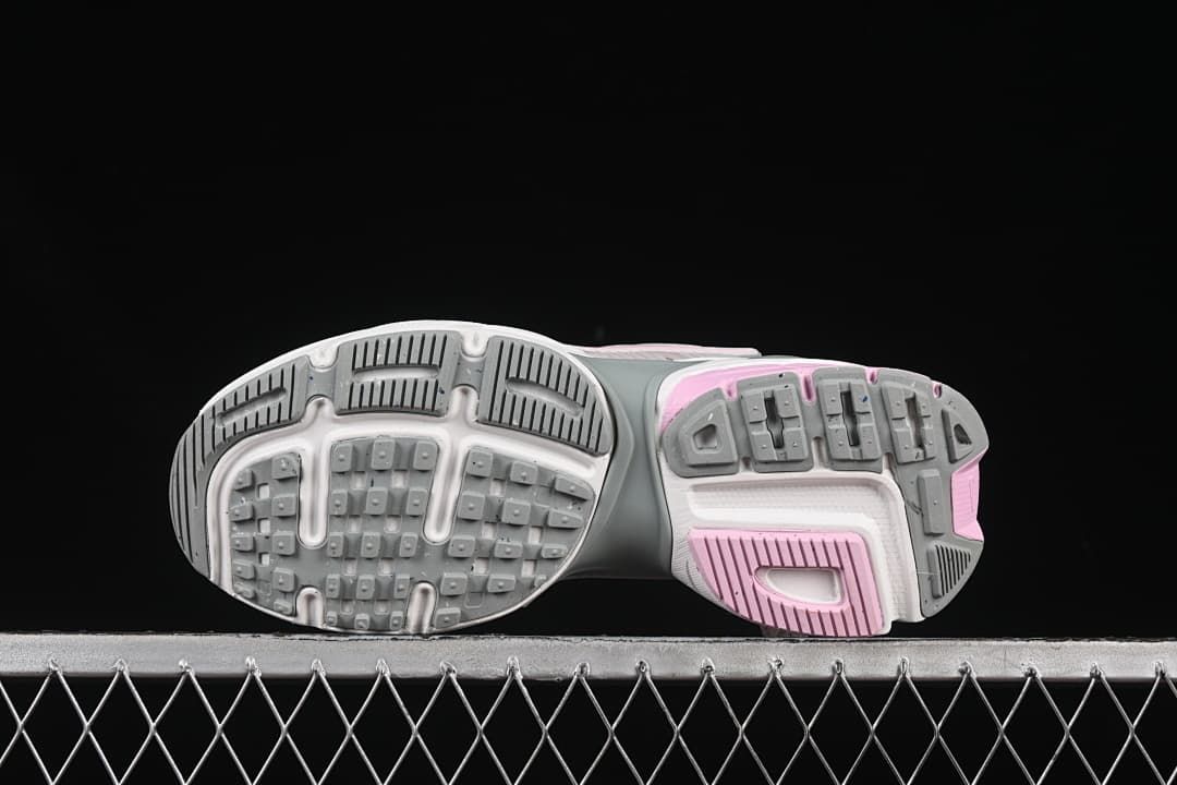 Underside view showing the patterned gray, white, and pink outsoles