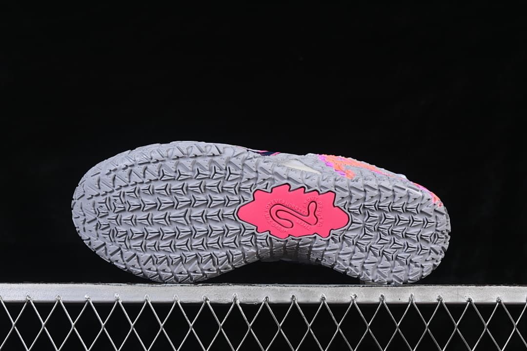 Outsole view with patterned tread and pink center detail