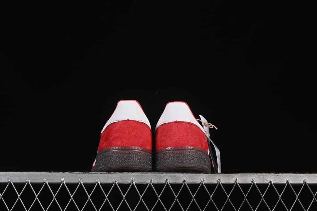 Rear view of both shoes showing white heel tabs