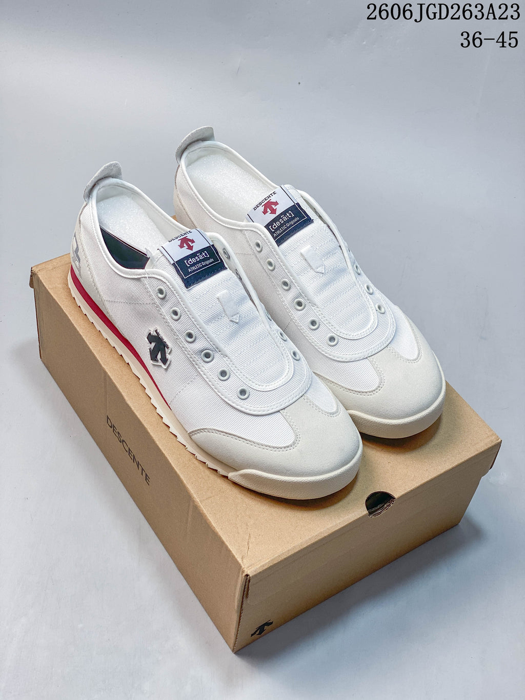 White DESCENTE Chron Tempo sneakers shown together on a box