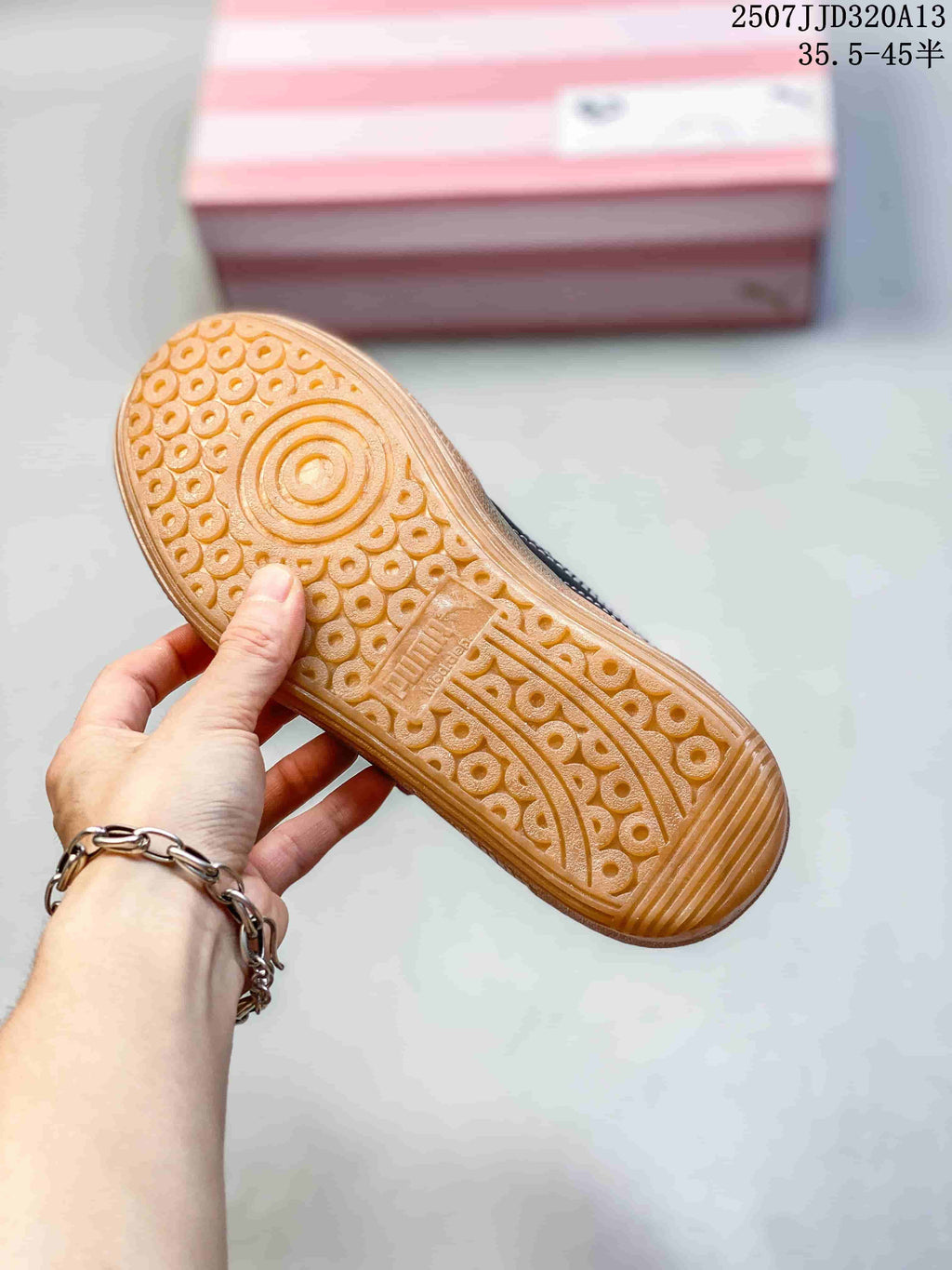Close-up of the patterned gum-colored outsole on a Puma Palermo sneaker