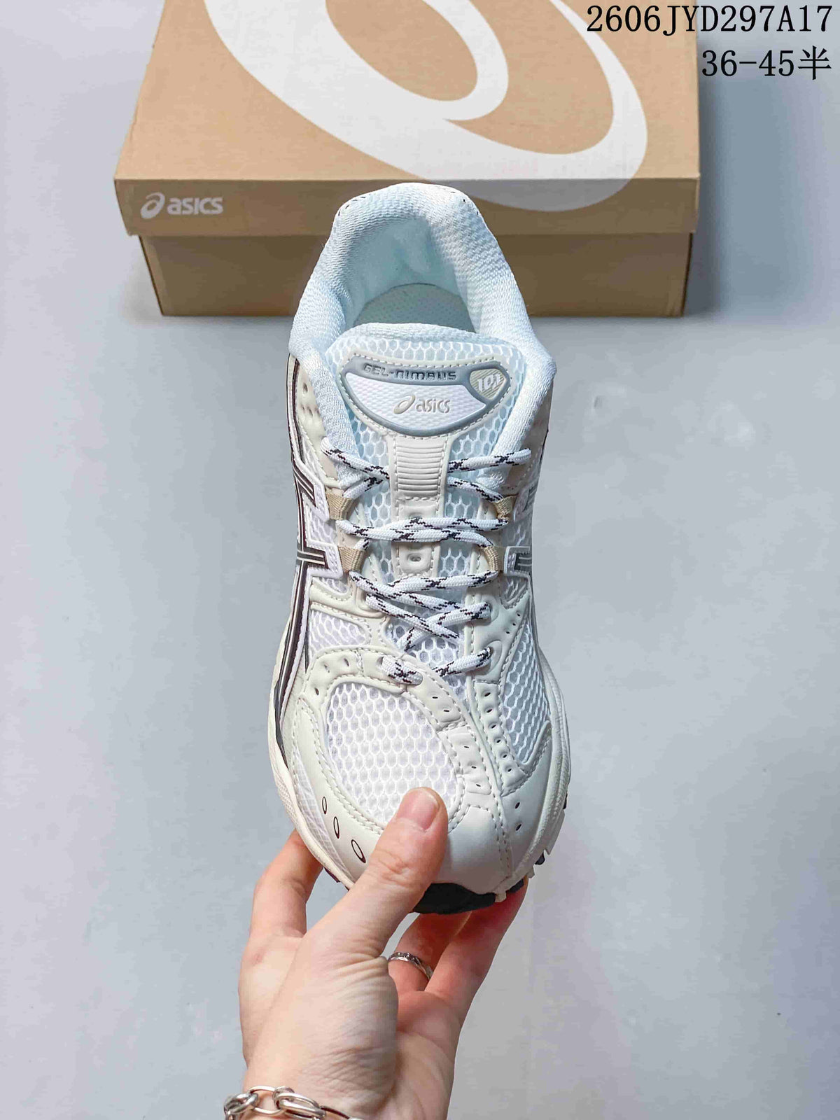 Top view of a white and gray lace-up sneaker with mesh-look panels.