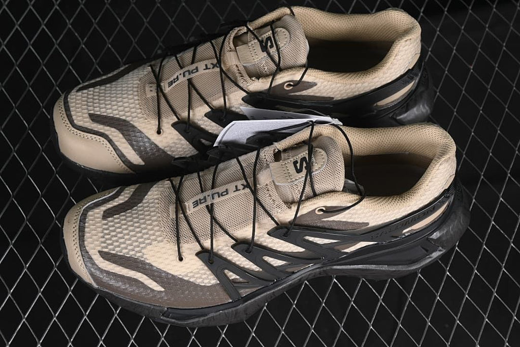 Pair of beige and black Salomon XT Pu.re Advanced shoes
