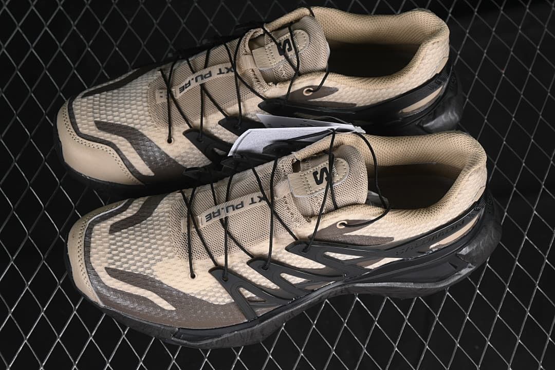 Pair of beige and black Salomon XT Pu.re Advanced shoes