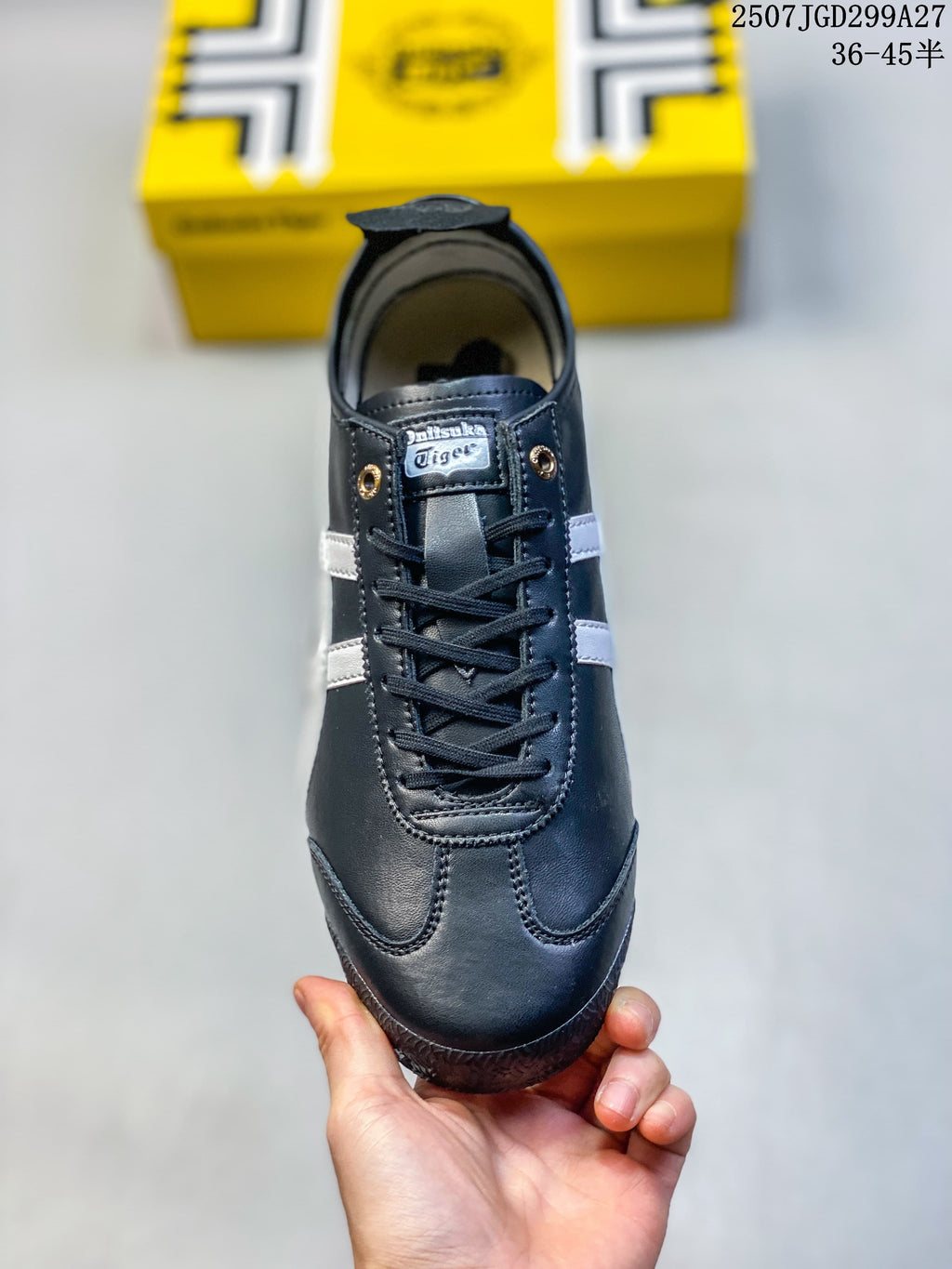 Front view of the laced sneaker with gold-tone eyelets