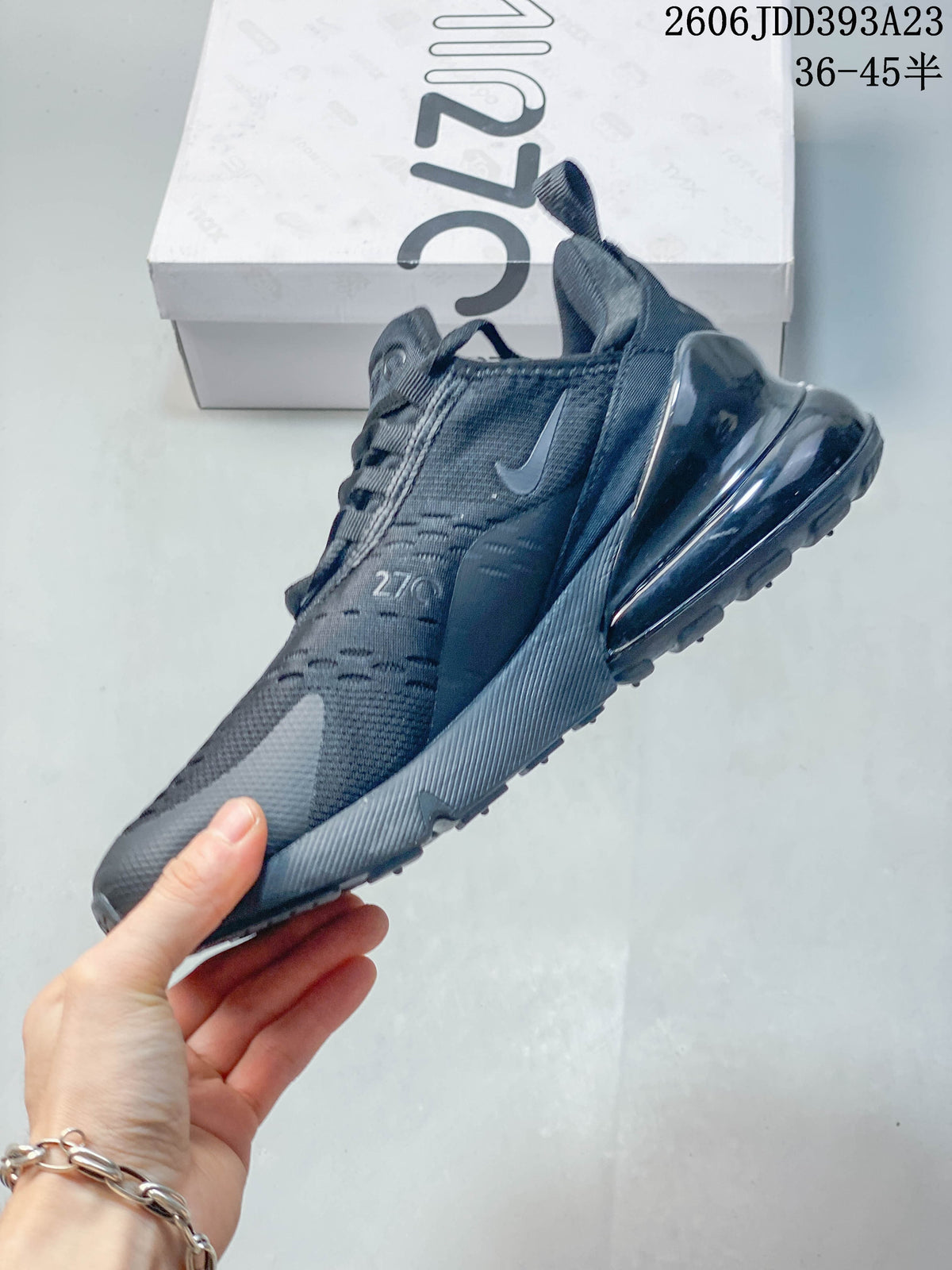 Side profile of a dark gray Nike Air Max 270 sneaker showing the heel Air unit