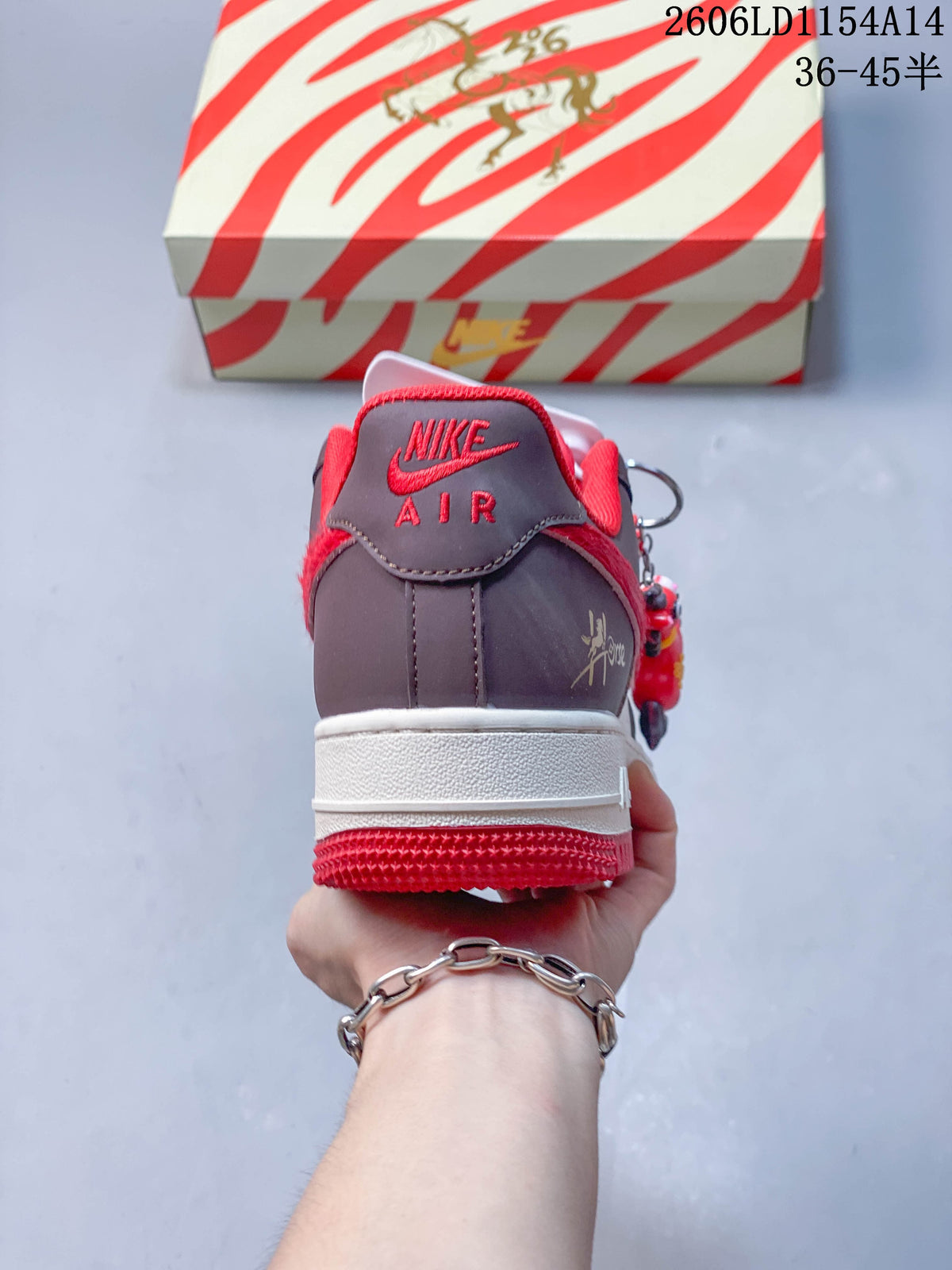 Rear view showing the brown heel panel, red collar, and white midsole.