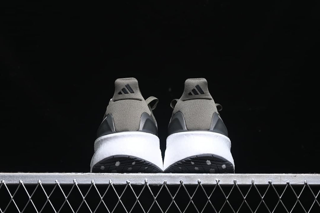 Rear view of both shoes showing heel tabs and white midsoles
