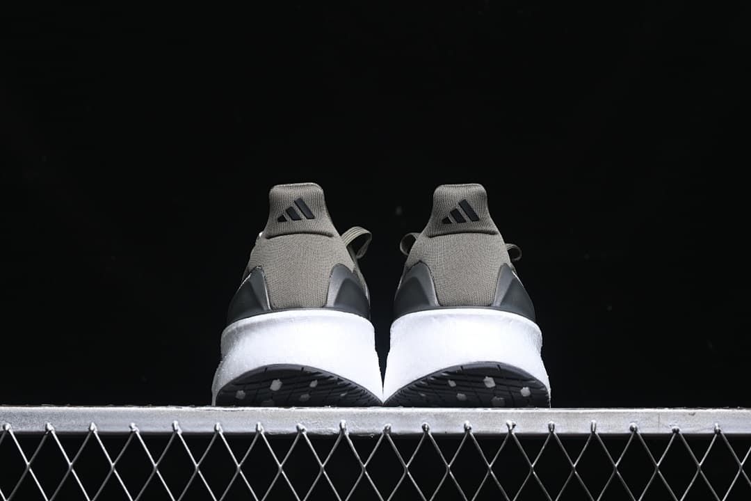 Rear view of both shoes showing heel tabs and white midsoles