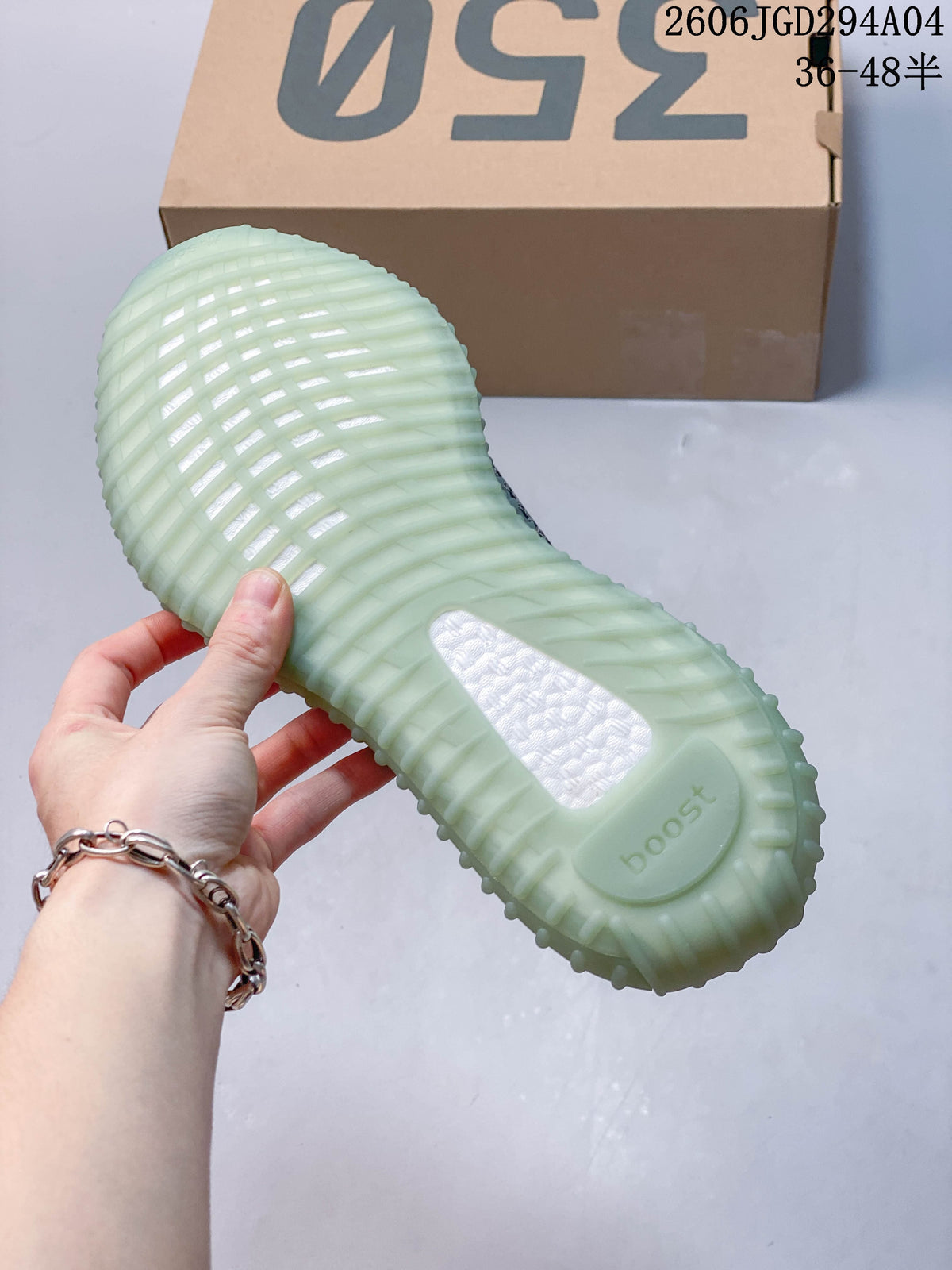 View of the ribbed pale aqua outsole on a Yeezy Boost 350 V2 sneaker