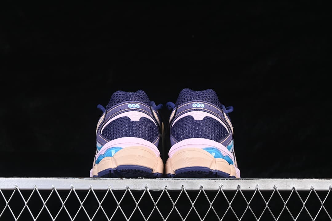 Rear view of the pair showing navy mesh heels and layered soles.
