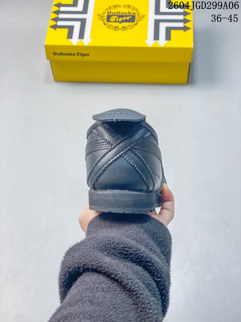 Rear view showing the stitched heel panels of a charcoal gray sneaker