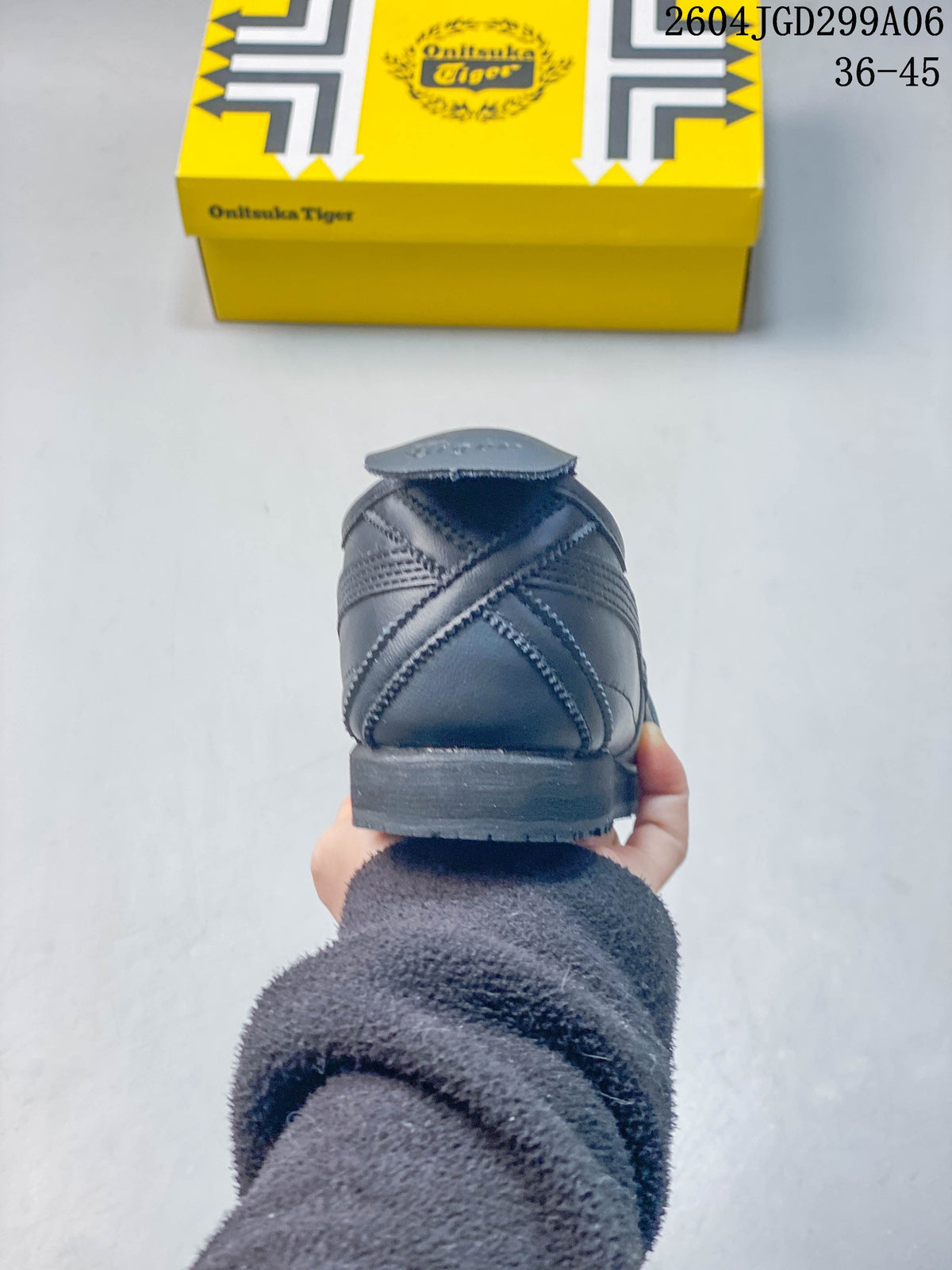 Rear view showing the stitched heel panels of a charcoal gray sneaker