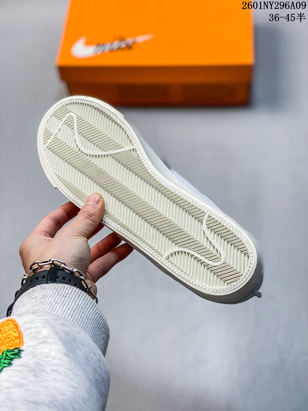 Close-up of the light-colored herringbone-pattern outsole.