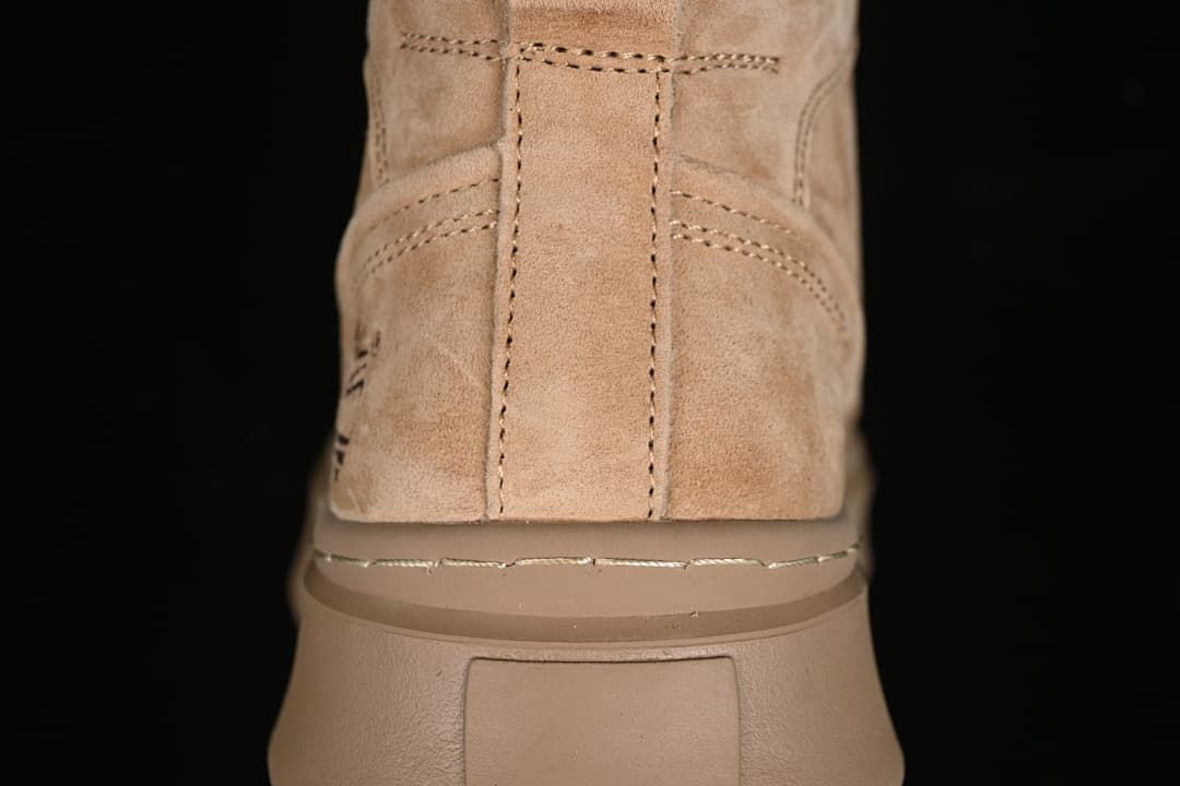 Rear view showing the boot's stitching and thick sole