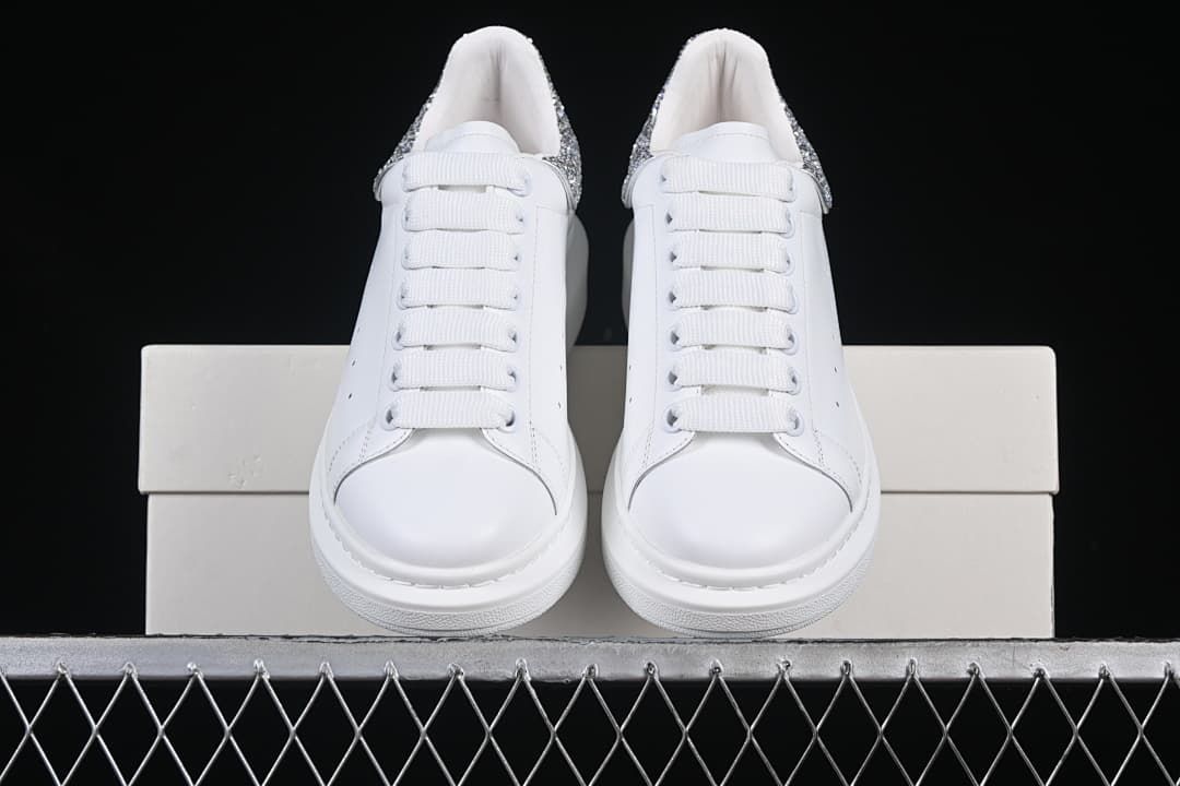 Front view of the pair showing white laces and toe shapes.
