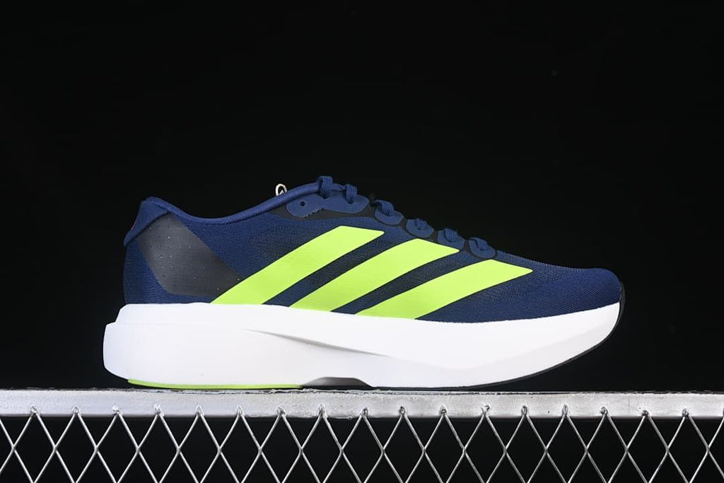 Side profile of a navy running shoe with lime stripes and a white midsole.