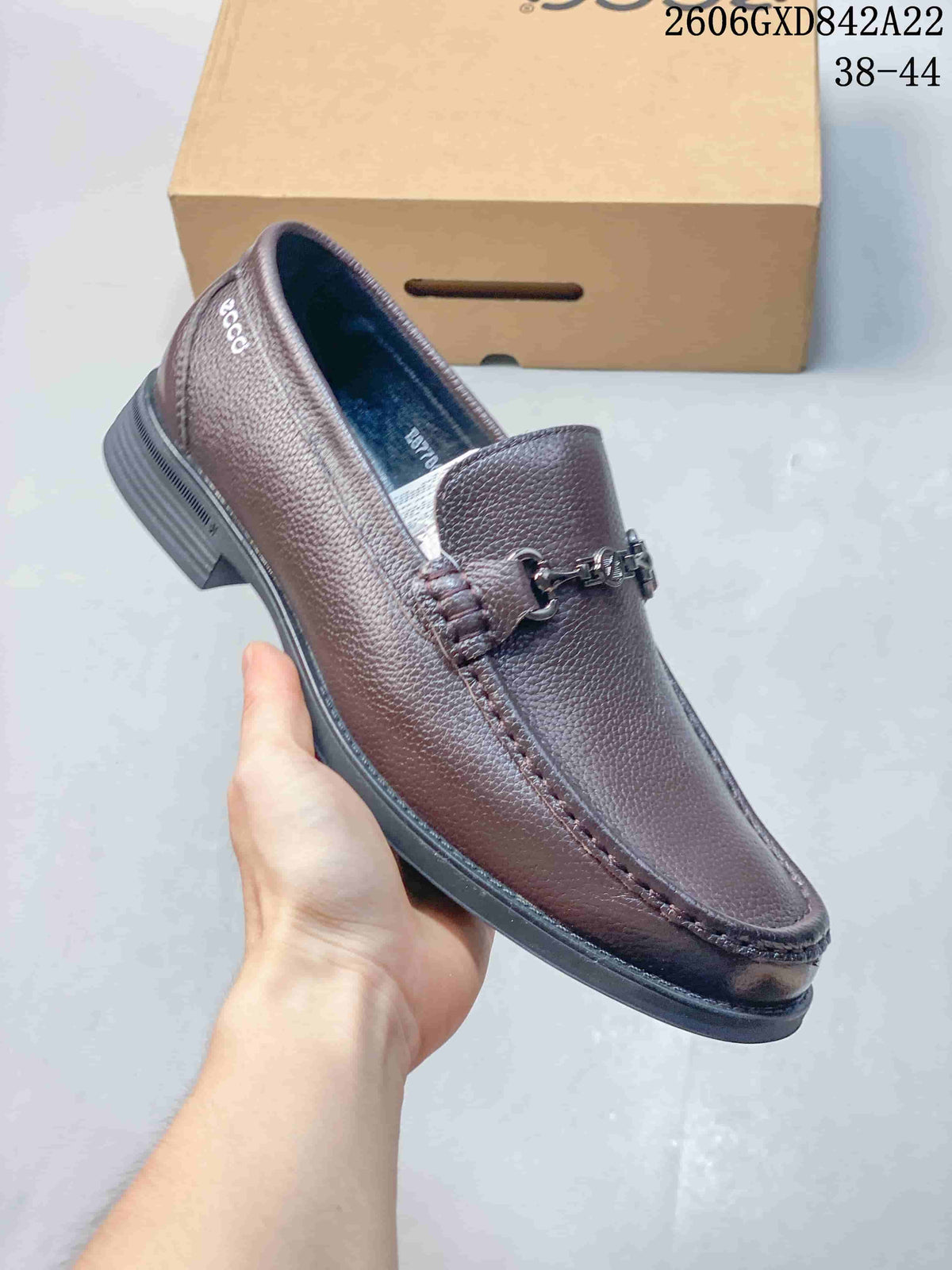 Angled view of a brown pebbled-finish loafer with metal bit detail