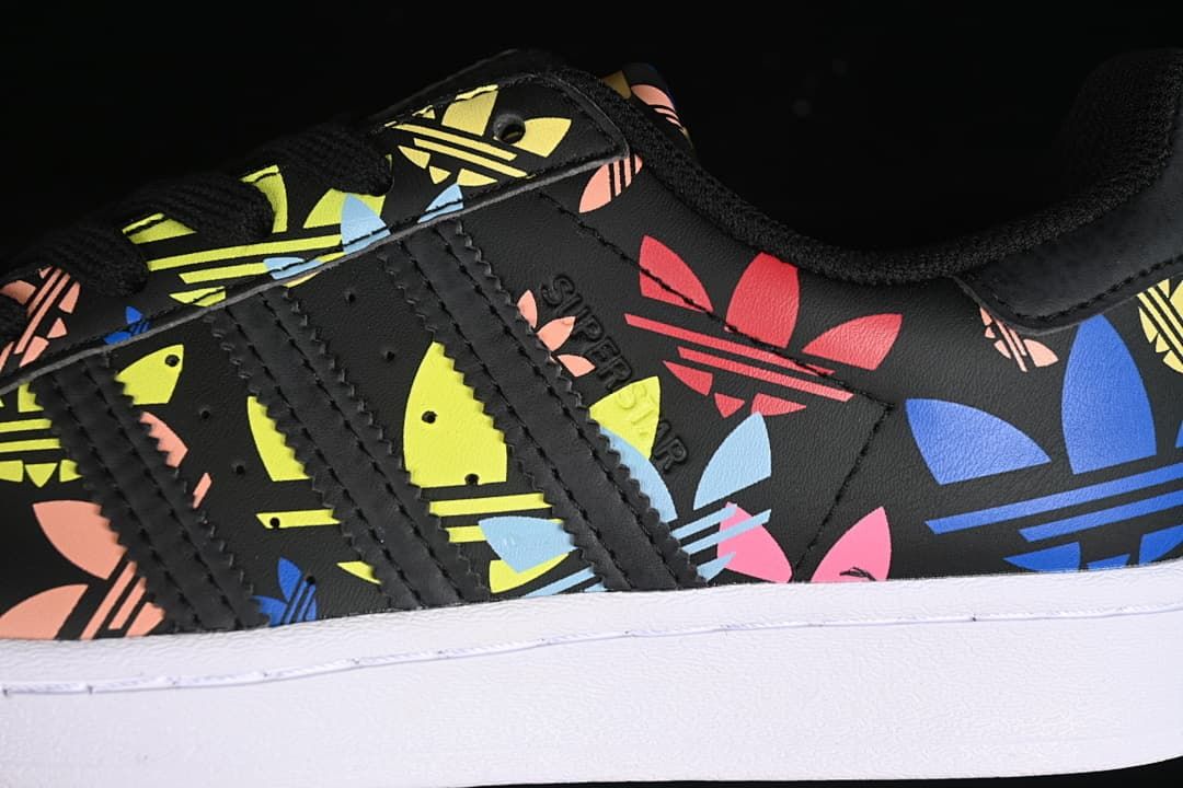 Close-up of the side stripes and colorful Trefoil print