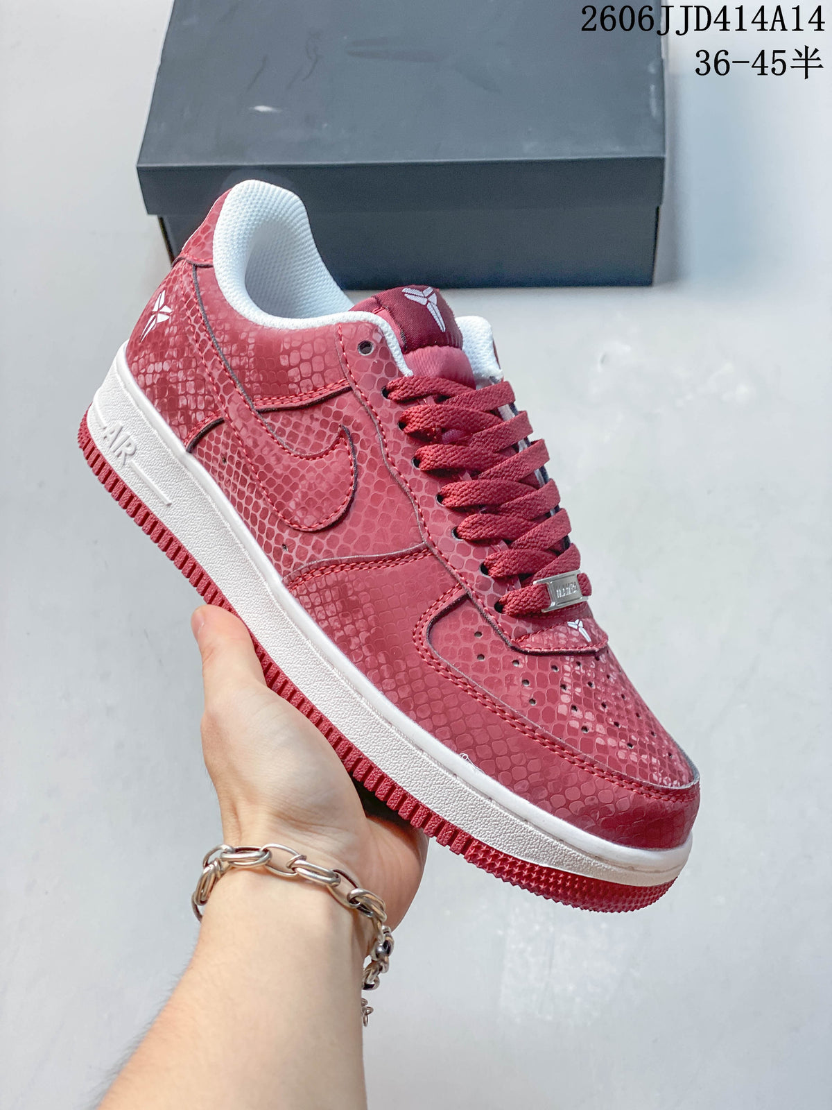 Angled side view of a red patterned low-top sneaker
