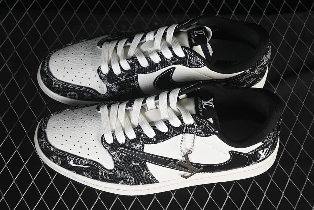 Top view of a pair of black-and-white low-top sneakers with white laces