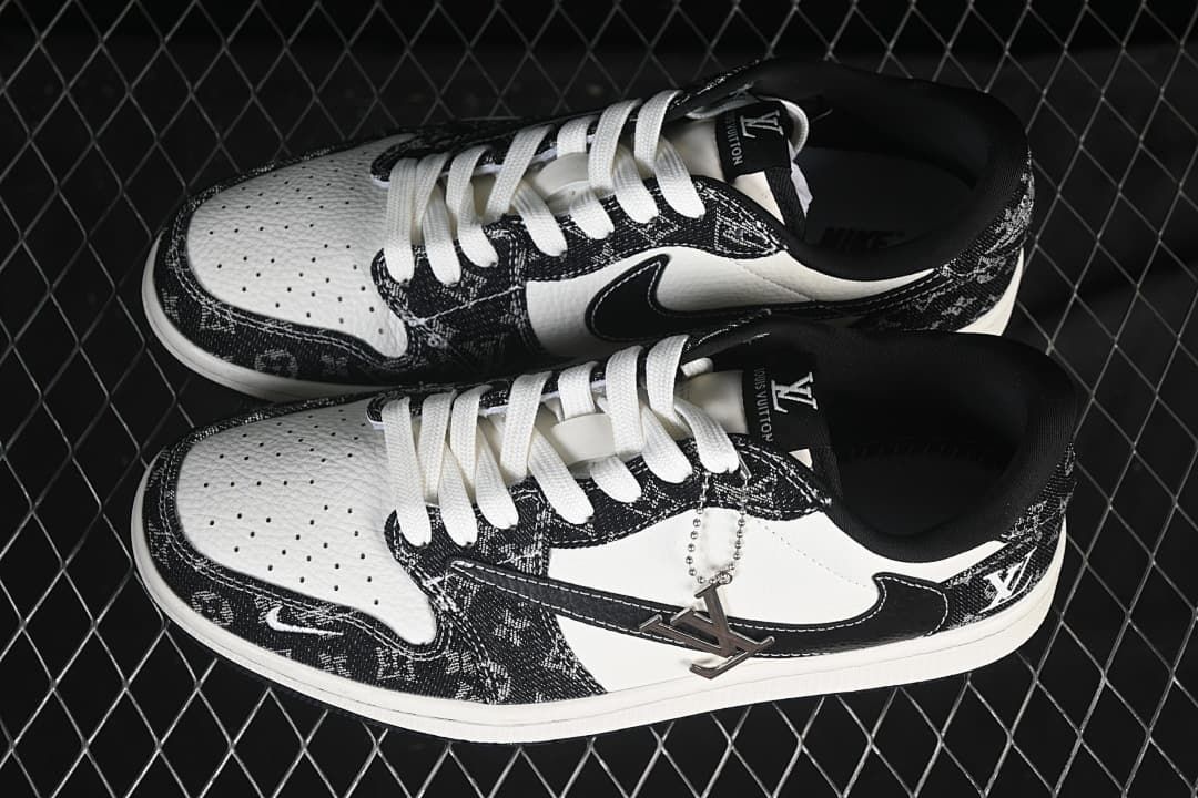Top view of a pair of black-and-white low-top sneakers with white laces