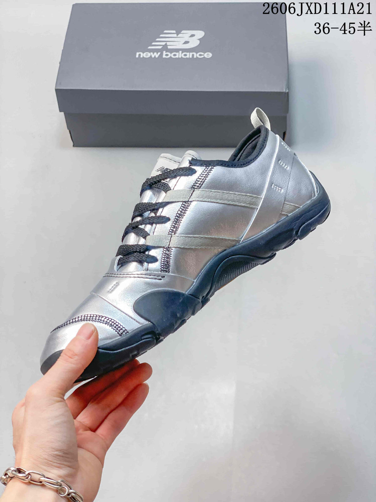 Side profile of the silver-toned low-top sneaker