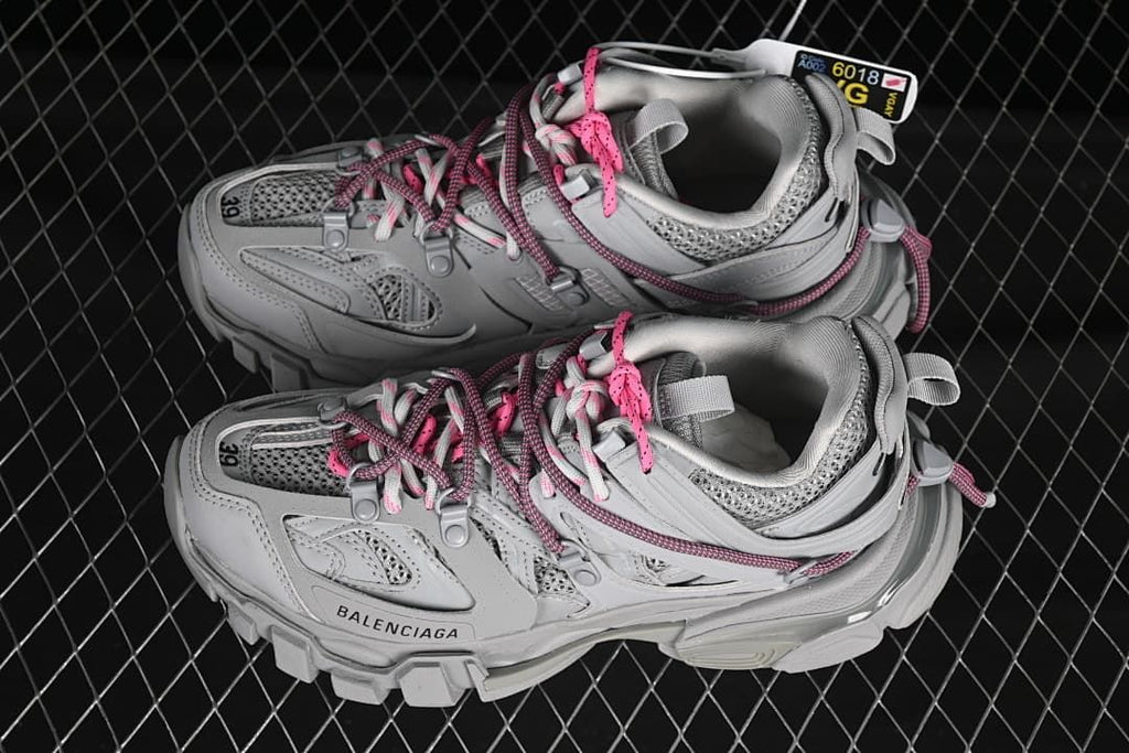 Pair of grey Track sneakers viewed from above