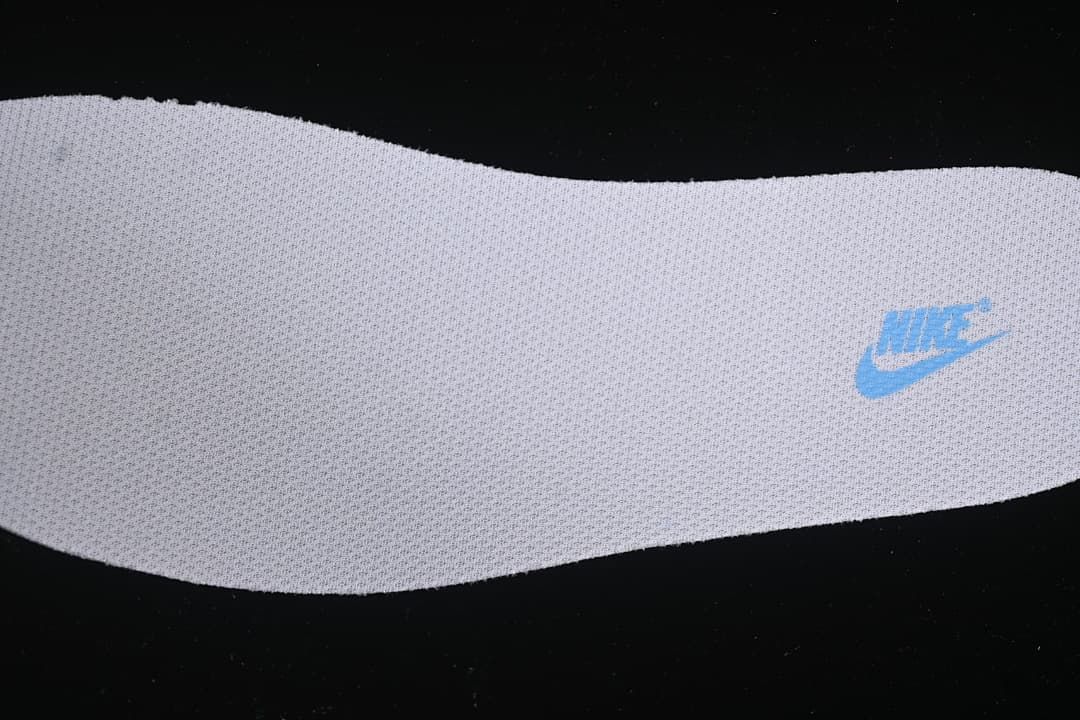 Close-up of the textured insole with blue Nike branding