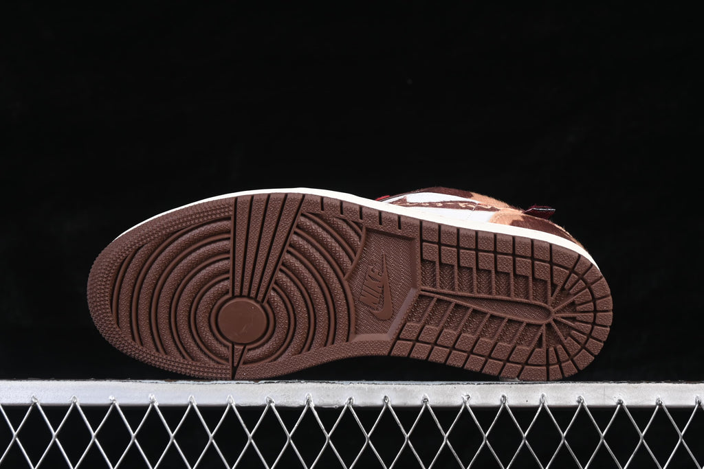 Underside view showing the dark brown outsole tread of the Air Jordan 1 Low.