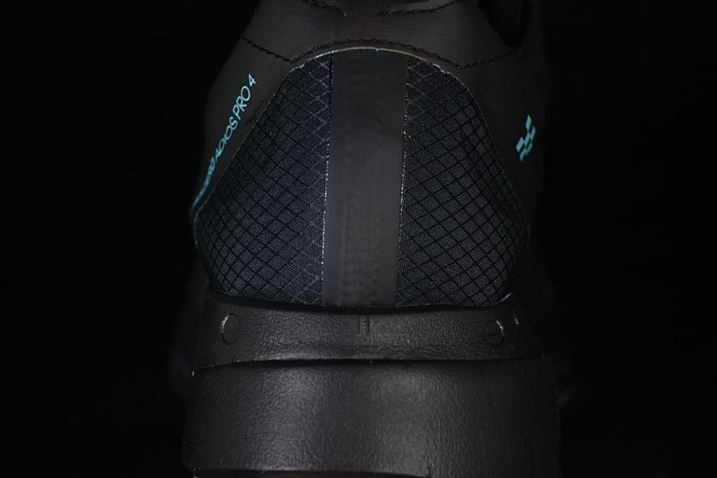 Rear view showing the patterned heel and turquoise details