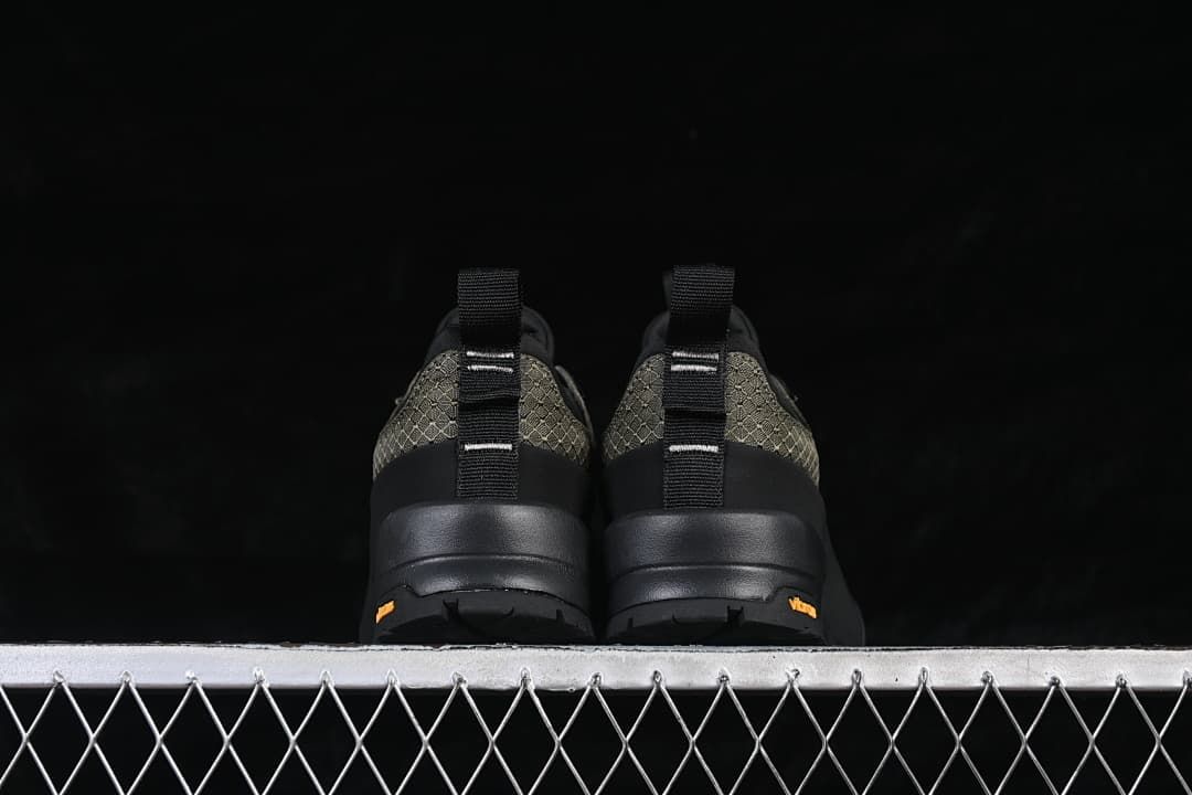 Rear view of the pair showing heel pull tabs and outsole details