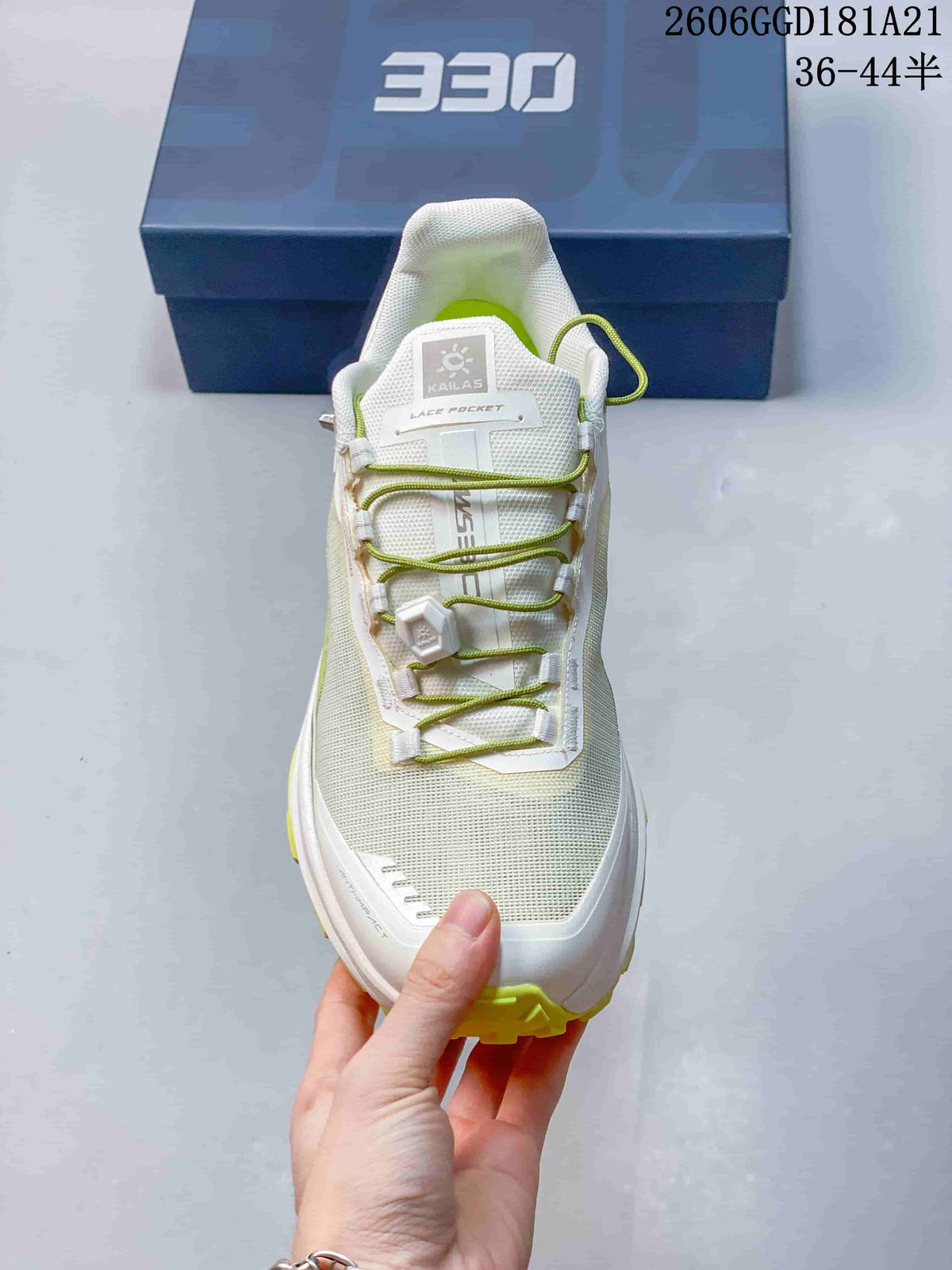 Front view showing the mesh-like upper, dial closure, and tongue lace pocket