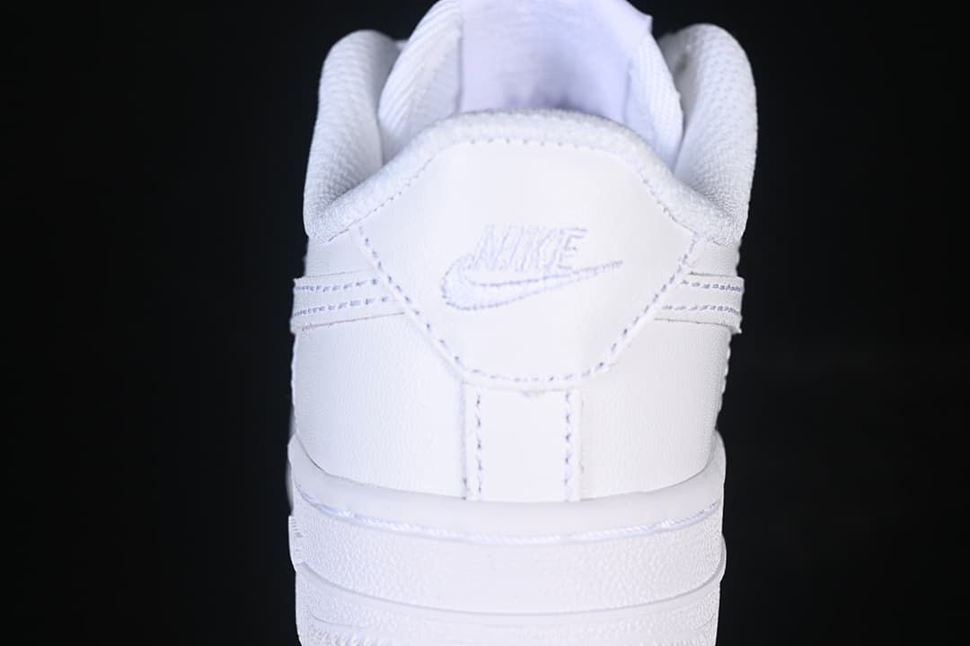 Rear view of the white sneaker with stitched branding