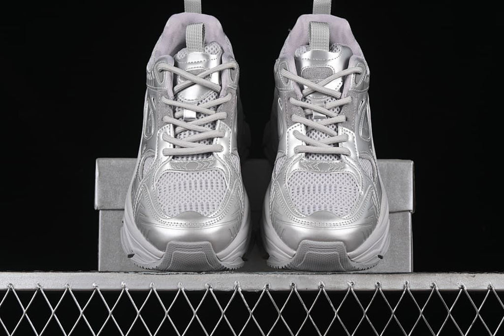 Front view of the pair of silver sneakers with chunky soles.
