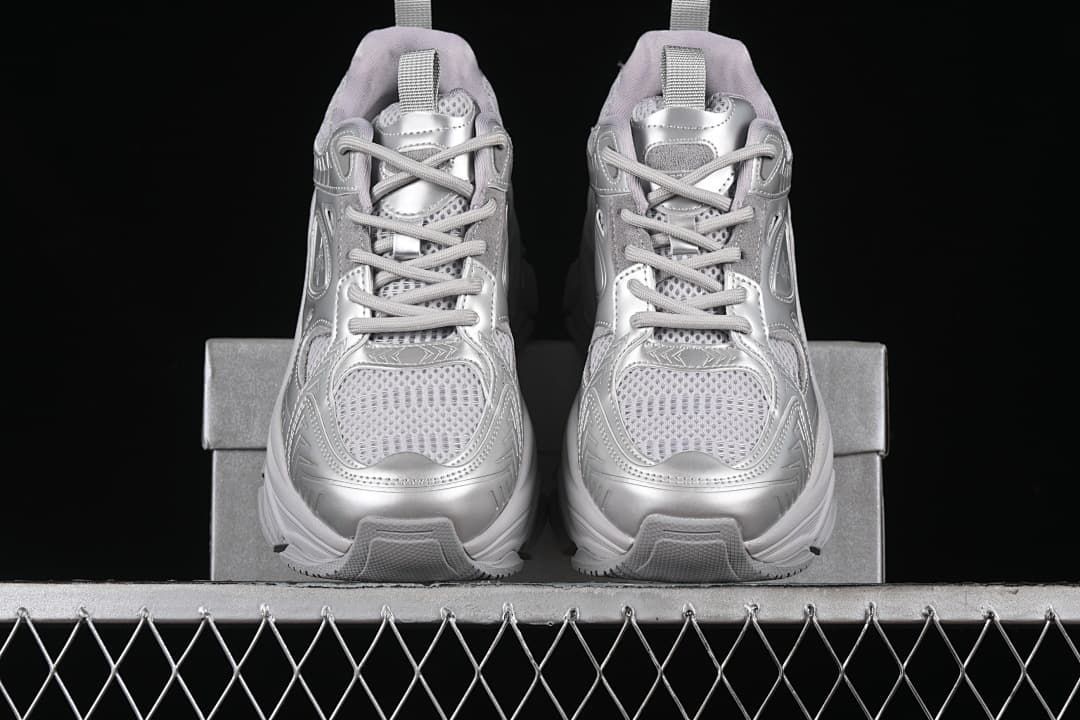 Front view of the pair of silver sneakers with chunky soles.