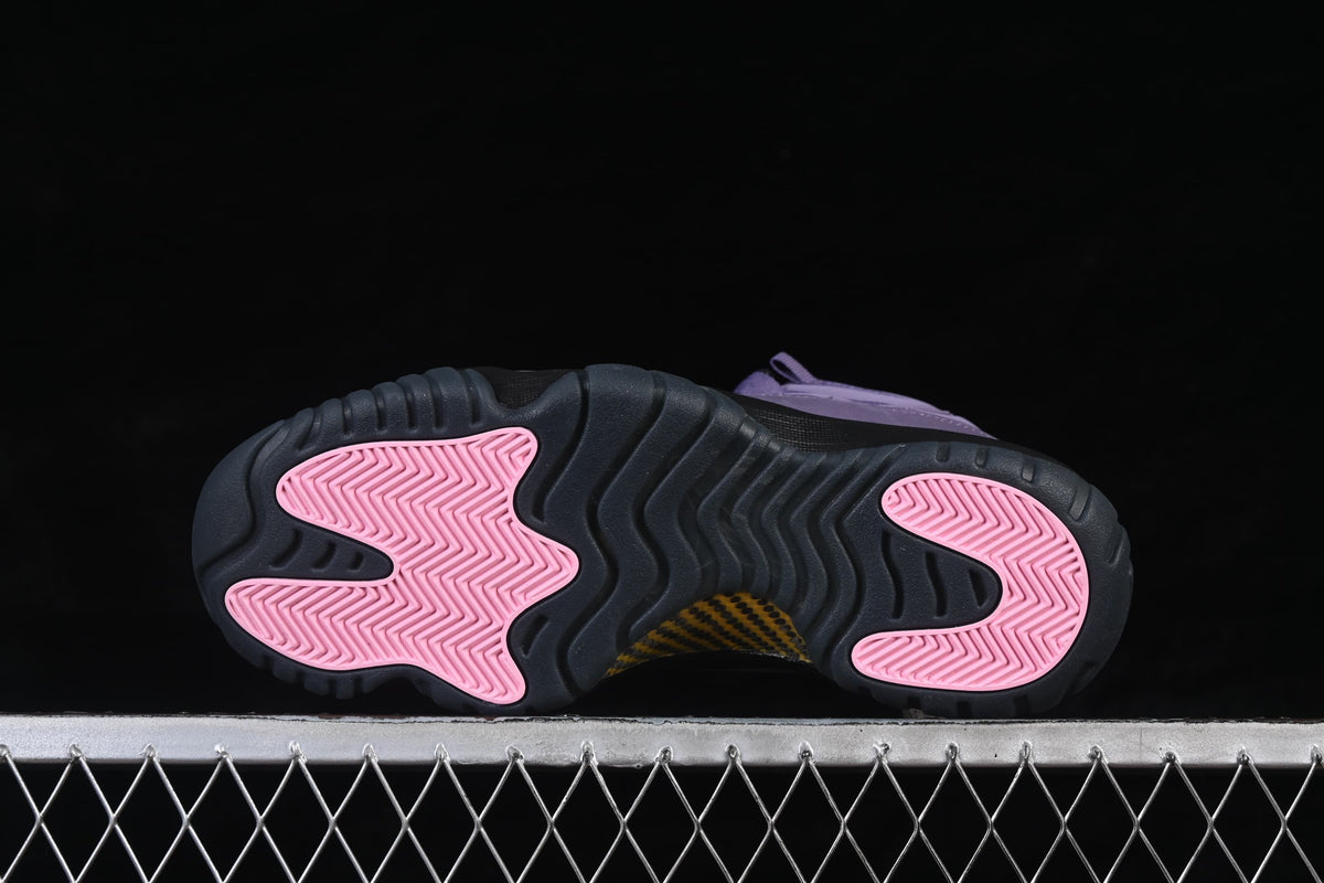 Outsole view showing dark tread and pink traction panels.