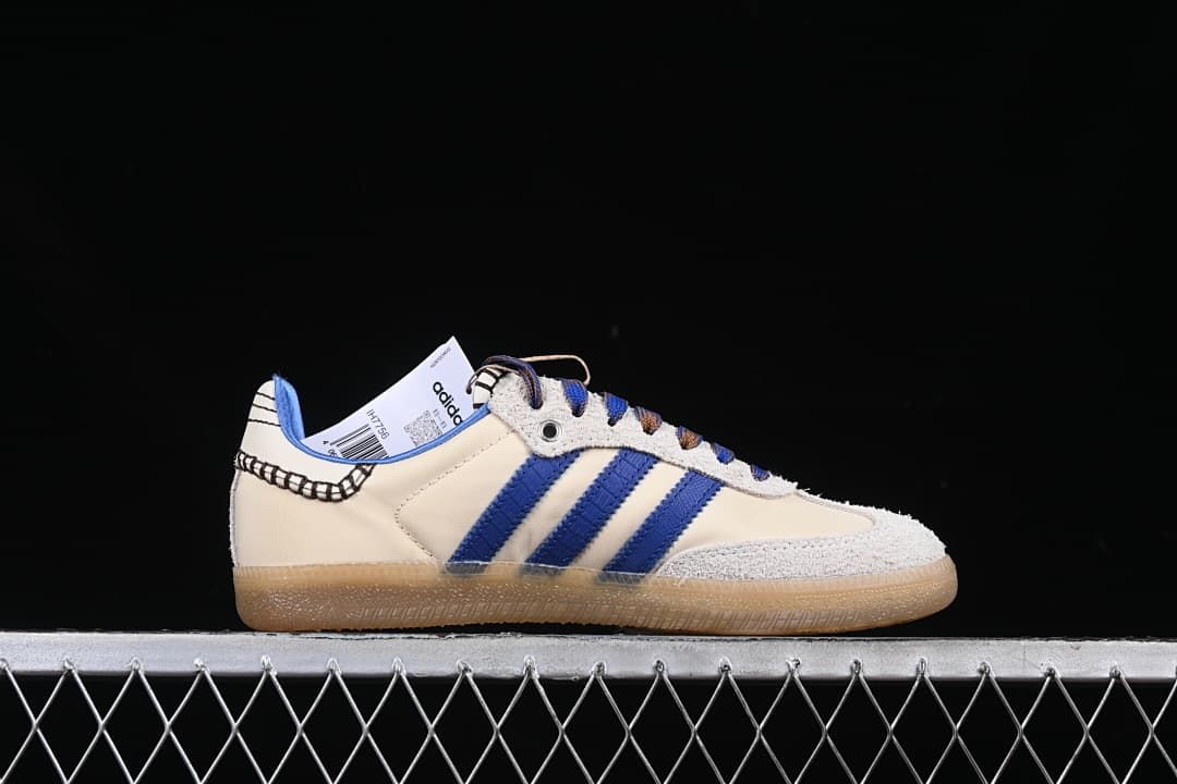 Side profile of the sneaker with blue stripes and textured toe overlay.