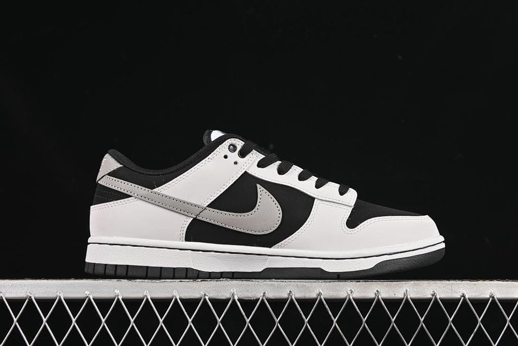 Side profile showing the layered panels and grey Swoosh