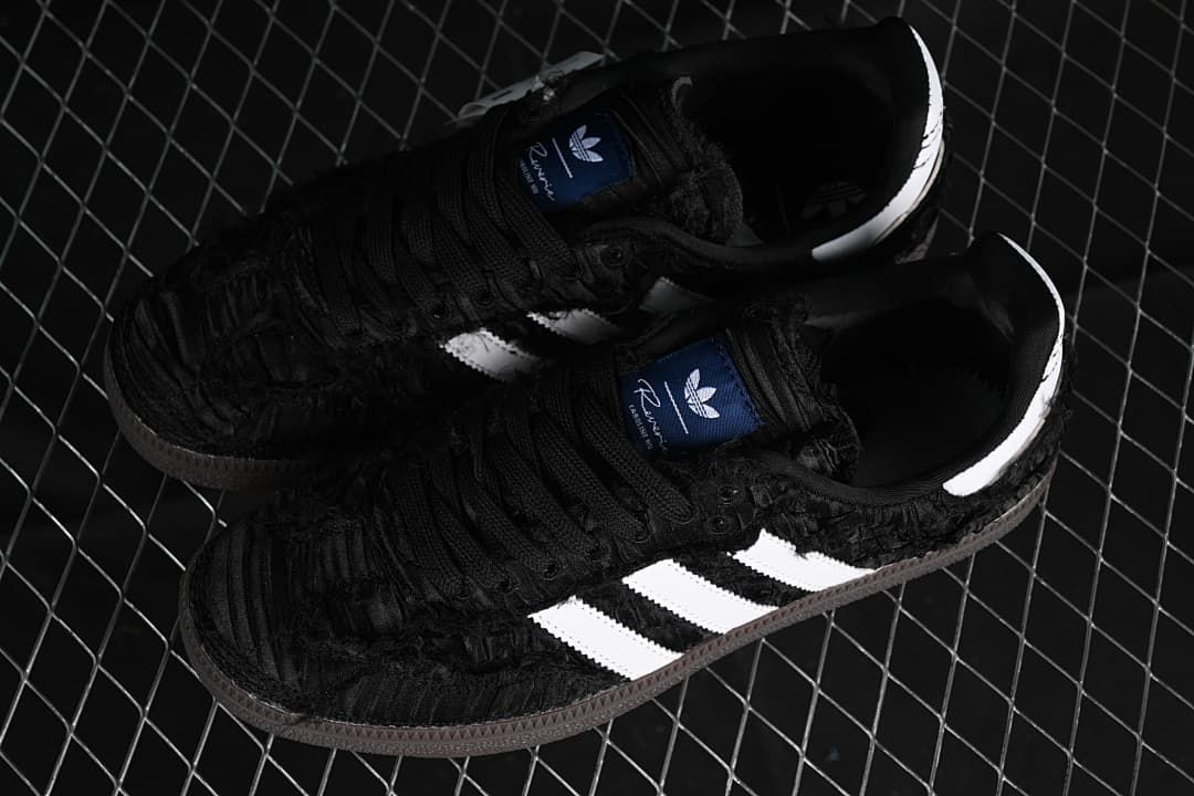 Pair of black Samba OG sneakers with white stripes