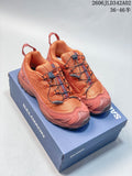 Orange and dark gray Salomon trail running shoes shown together.