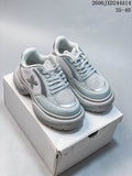 Pair of pale silver-gray SMFK lace-up sneakers with mesh-look panels and chunky soles