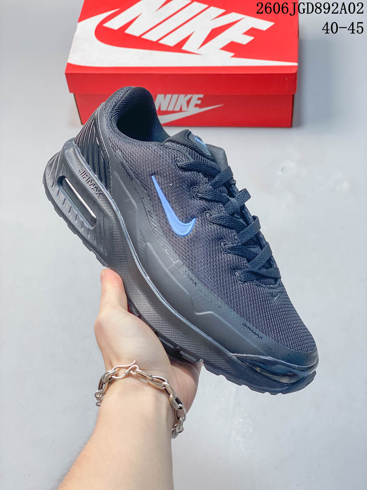 Angled side view of a dark gray Nike Air Max BIA shoe