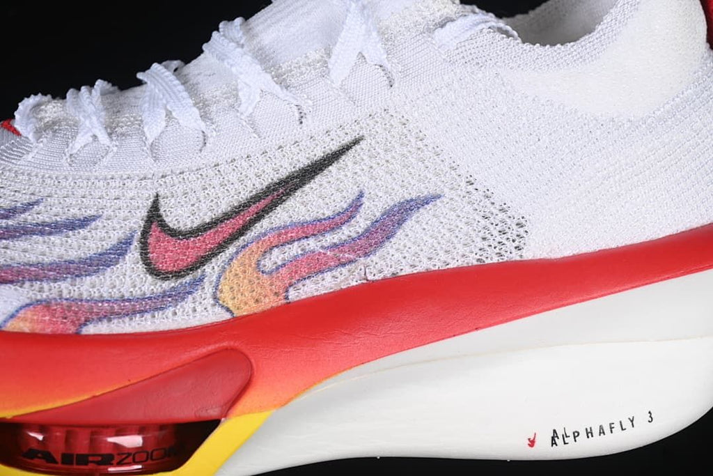 Close-up of the shoe's white upper, colorful side graphics, and sculpted midsole