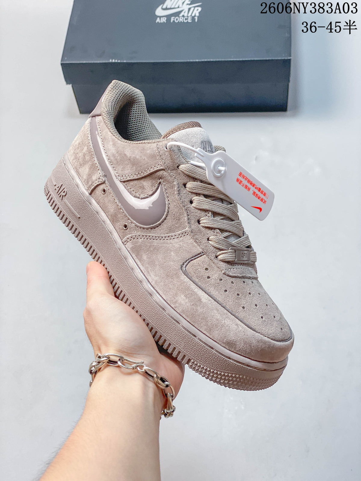 Angled side view of a taupe Nike Air Force 1 low-top sneaker