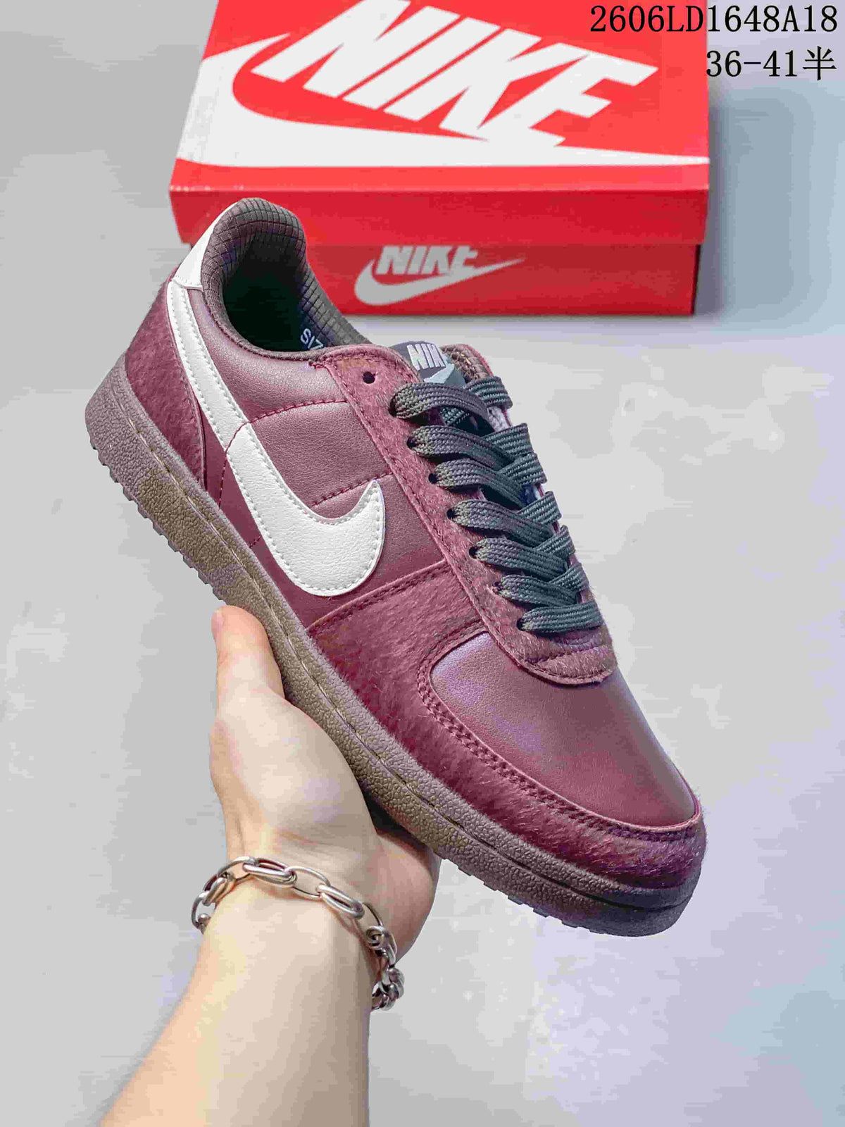 Angled view of the sneaker showing its side panels, Swoosh, and outsole