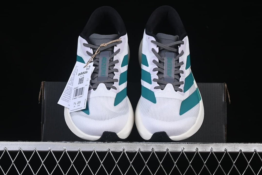Front view of the pair of running shoes with their product tag visible.